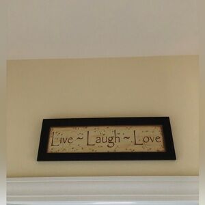 Brown Framed 'Live Laugh Love' Wall Art. 23”length, 7”height. Smoke/Pet free